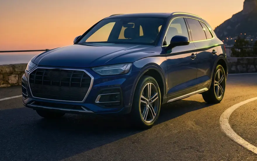 Audi Q5 on the Moyenne Corniche above Monaco at sunset — representative rendering